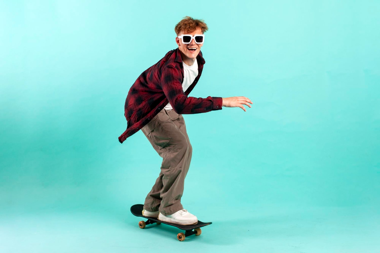 Cheerful Skater Riding Freely with Style, Confidence, and Sunglasses