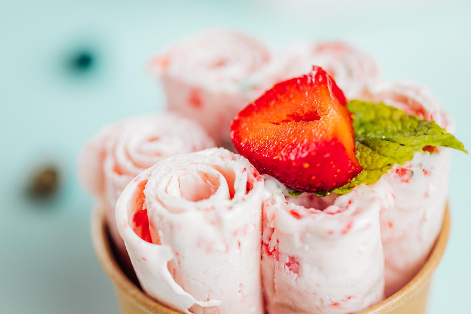 Delicious Strawberry Ice Cream Rolls Served Freshly In Chilled Container