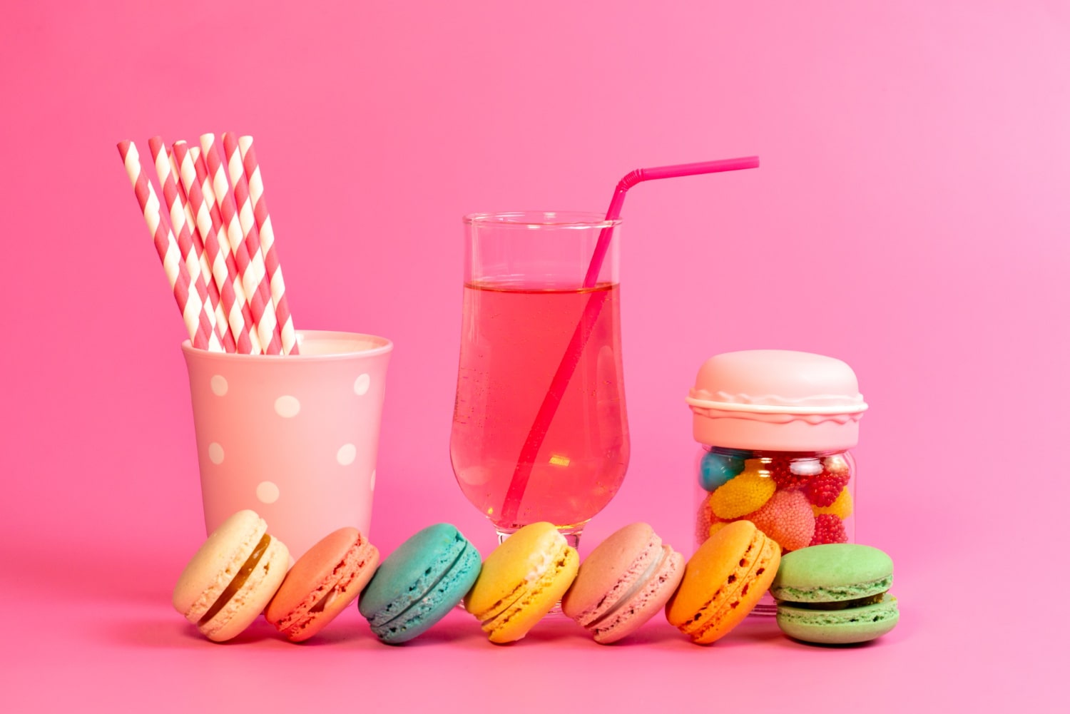 Colorful French Macarons With Sweet Candies And Refreshing Drink